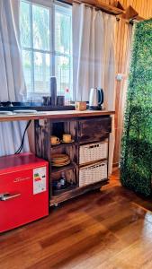 a kitchen with a counter with a sink and a window at Cabaña Tu Refugio in Paraná +10 photos
