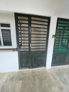 a pair of doors on a building at PD Laguna Resort Vacation in Kampong Tanah Merah