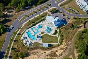 an aerial view of a park with a pool at Just Peachy VillageOBX in Kill Devil Hills