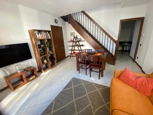 a living room with a couch and a table at La mansardina del mulino in Lodi