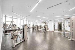 a large gym with treadmills and machines at Luxury Cityscape Condo in Toronto
