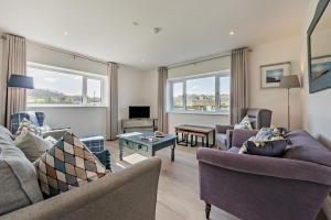 a living room with two couches and a tv at 6 Bed in Llanarthney oc-c28878 in Llanarthney
