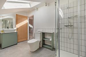 a bathroom with a toilet and a sink and a shower at 6 Bed in Llanarthney oc-c28878 in Llanarthney +25 photos