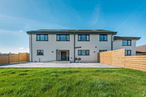 a large white house with a green yard at 6 Bed in Llanarthney oc-c28878 in Llanarthney