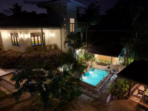 an overhead view of a swimming pool at night at The Vitamin Sea in Ambalangoda