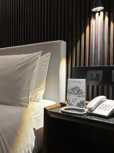 En eller flere senge i et værelse på Hotel Portobelo