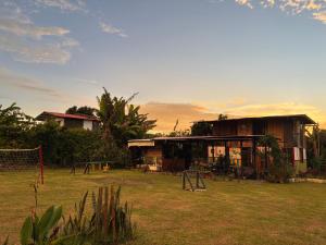 a house with a playground in the yard at cabaña hotel oasis in Montenegro