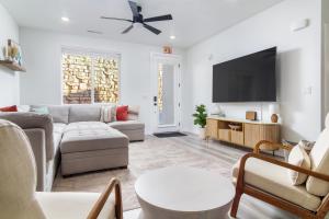 a living room with a couch and a flat screen tv at Sunny Springs, Hurricane, Ut in Hurricane
