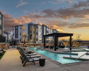 a resort with a swimming pool and a building at Sunny Springs, Hurricane, Ut in Hurricane