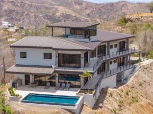 an aerial view of a house with a swimming pool at NEW! Oceanview, Infinity Pool, Spacious & Private Luxury Group Retreat in Potrero