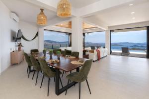 a dining room and living room with a table and chairs at NEW! Oceanview, Infinity Pool, Spacious & Private Luxury Group Retreat in Potrero