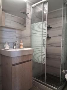 a bathroom with a sink and a shower at Katrin chios in Chios +52 photos