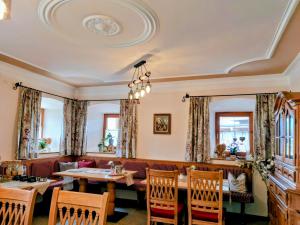 a dining room with a table and chairs at Lampererhof in Sankt Johann in Tirol