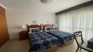 a bedroom with two beds and a window at Casa Laura in Valle Gran Rey