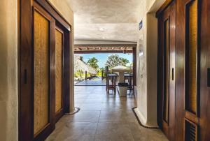 an open hallway with a view of the ocean from a house at El Secreto Residencial in Zihuatanejo +36 photos