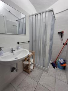 a bathroom with a sink and a shower at La casa del Belvedere in Grassano +32 photos