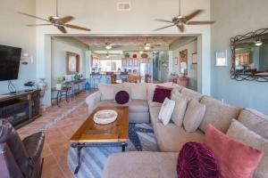 a living room with a couch and a table at Spacious Beachfront Condo Las Palmas II 11A in Puerto Peñasco +32 photos