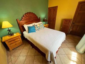 a bedroom with a bed and a lamp on a table at Comfortable Beachfront Condo Las Palmas II 11 B in Puerto Peñasco