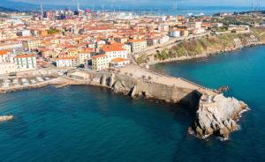 an aerial view of a city and the ocean at Garibaldi Art Apartment in Piombino