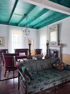 a living room with a couch and a table at The Courtableau Cottage in Washington