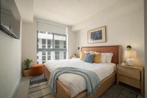 a bedroom with a bed and a large window at Crosby Miami World Center in Miami +58 photos