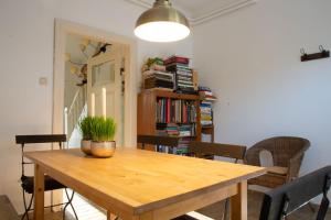 a dining room table with a potted plant on it at Zur Waldschmiede in Kakenstorf