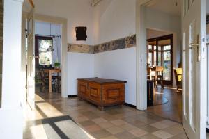 a hallway of a house with a table on the wall at Zur Waldschmiede in Kakenstorf