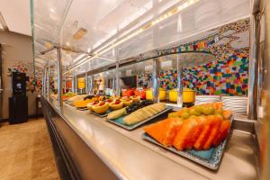 a buffet line with many different types of fruits at Pestana Rio Atlantica in Rio de Janeiro
