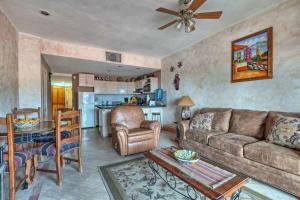 a living room with a couch and a table at Unique Colorful Condo on 3rd Floor Pinacate 321 in Puerto Peñasco +25 photos