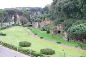 a park with a field of grass next to a road at Casa Vacanze Dolce Angelo in Sutri