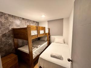 a small room with two bunk beds in it at Modern house with pool in Ica in Ica +31 photos