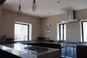 a kitchen with a stove and a counter top at Casa Ancestra in Santa Cruz