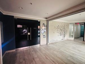 a room with a hallway with a wall with spheres on it at Steps from UCLA Westwood 1 Bd 1Ba in Los Angeles