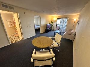 a room with a table and chairs and a bedroom at Steps from UCLA Westwood 1 Bd 1Ba in Los Angeles