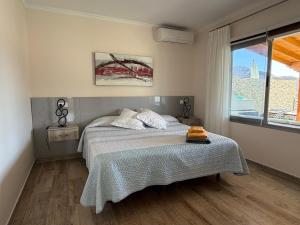 a bedroom with a bed and a window at Villa Sunset Tauro in Mogán +15 photos
