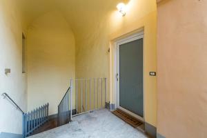 a door in a room with a hallway at Monolocale Piazza Garibaldi in Saluzzo