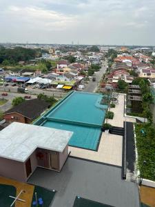 an overhead view of a swimming pool in a city at Cloud9 Homestay D Aman Residence in Alor Setar