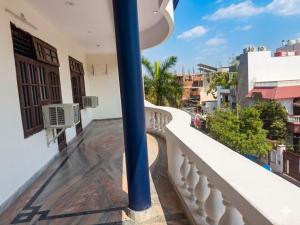 a balcony with a view of a city at Heritage Inn Gomti Nagar in Lucknow