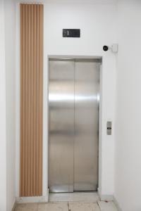 a elevator with a metal door in a building at Spacious 2 BR appartment near mall -Internet 1Gbps in Paphos