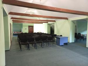 a room with a large room with chairs and a table at Квітка Закарпаття in Polyana +93 photos