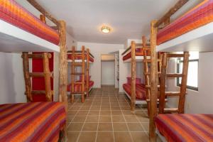 a room with four bunk beds in a room at Beautiful Huge Beachfront Home Serenity Beach in Puerto Peñasco +30 photos