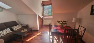a living room with a couch and a table at Ca Na Daniela in Carreña de Cabrales