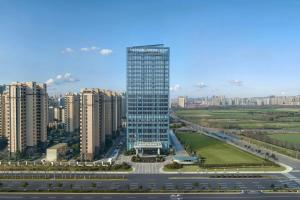 a tall building in the middle of a city at Four Points by Sheraton Hefei, Qirui in Hefei