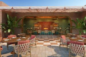 a rendering of a restaurant with tables and chairs at Amerruk, Marrakech, Autograph Collection in Marrakesh