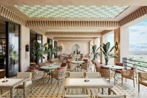 a rendering of a restaurant with tables and chairs at Amerruk, Marrakech, Autograph Collection in Marrakesh