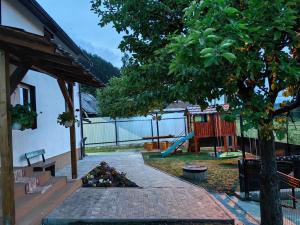 a park with a playground with a slide at Casa MATEO in Topliţa