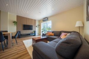a living room with a couch and a table at Ninase Villa in Ninaze