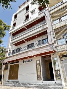 a building with a sign on the front of it at Résidence Madior F2 in Dakar