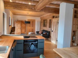 a kitchen with a stove top oven in a room at Ferienhaus Träglhof in Hirschau