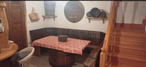 a small table in a room with a table with a table cloth at Kuća za zabavu ili odmor-Pegas in Orehovica +12 photos